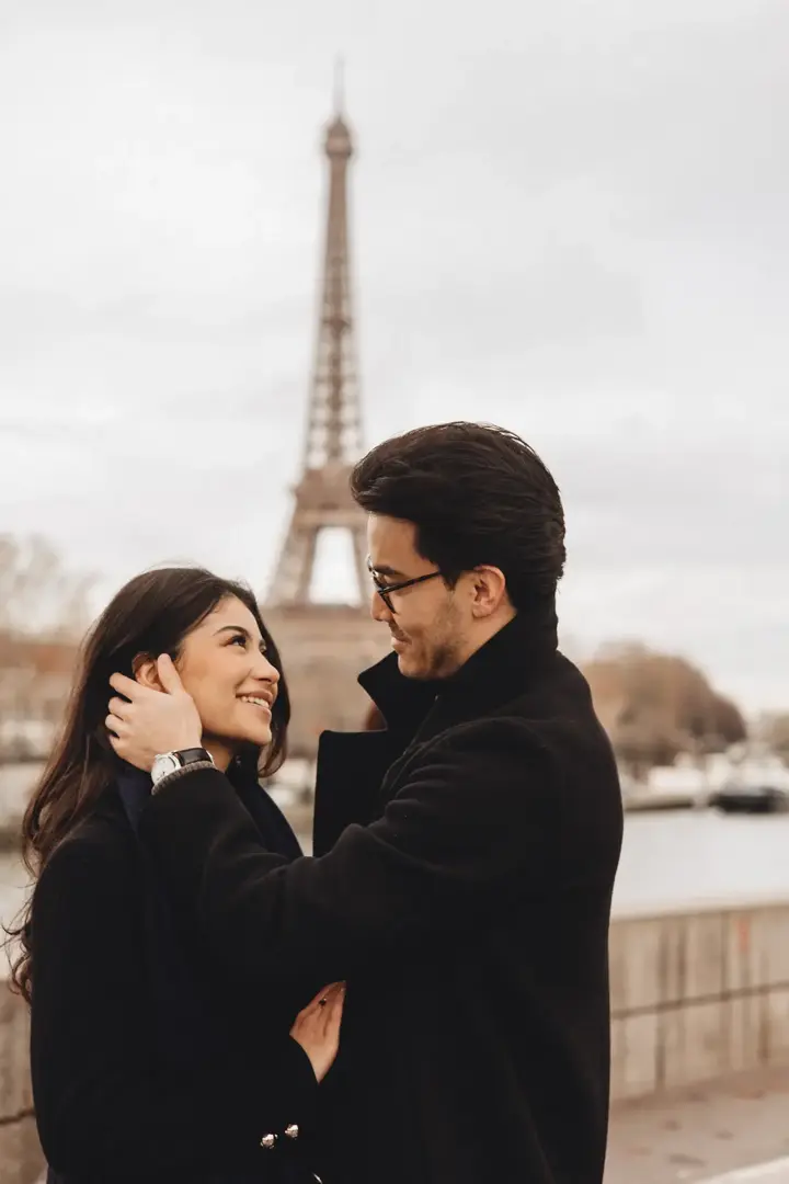 Couple embrace Eiffel Tower medium shot Paris