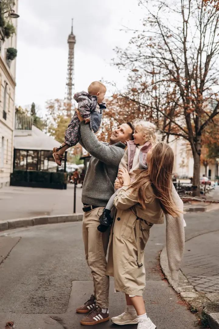 Family of four autumn Paris Eiffel Tower laughing