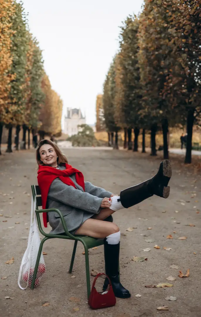 Woman red scarf autumn Tuileries alley Paris