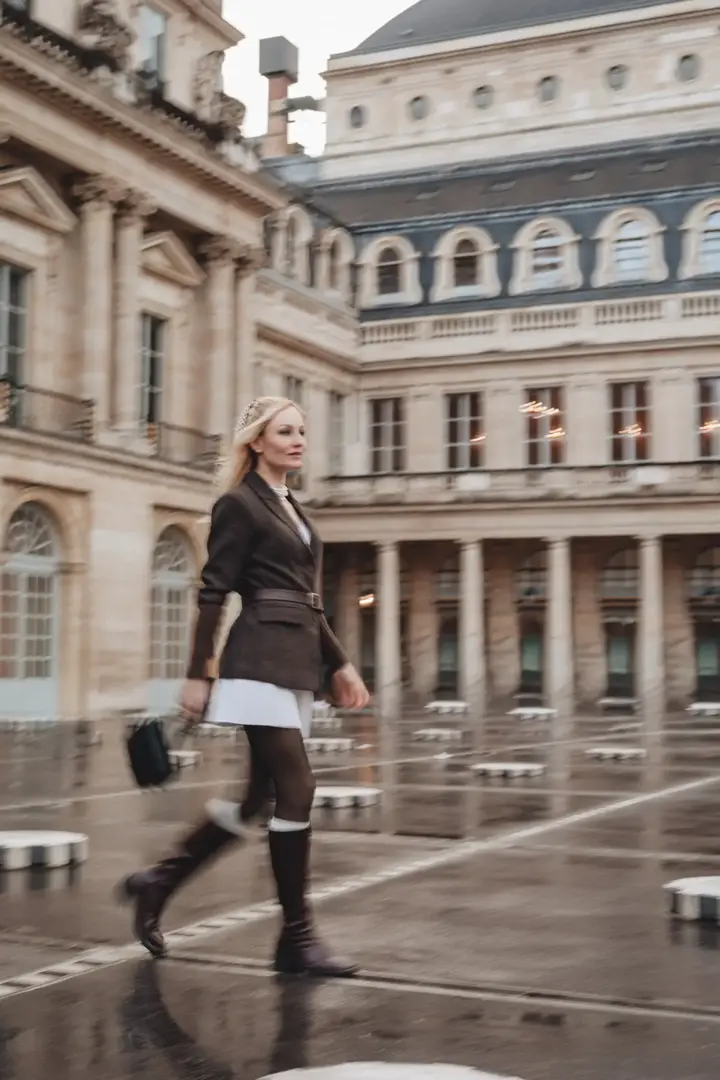 Woman walking Palais Royal motion blur cinematic Paris